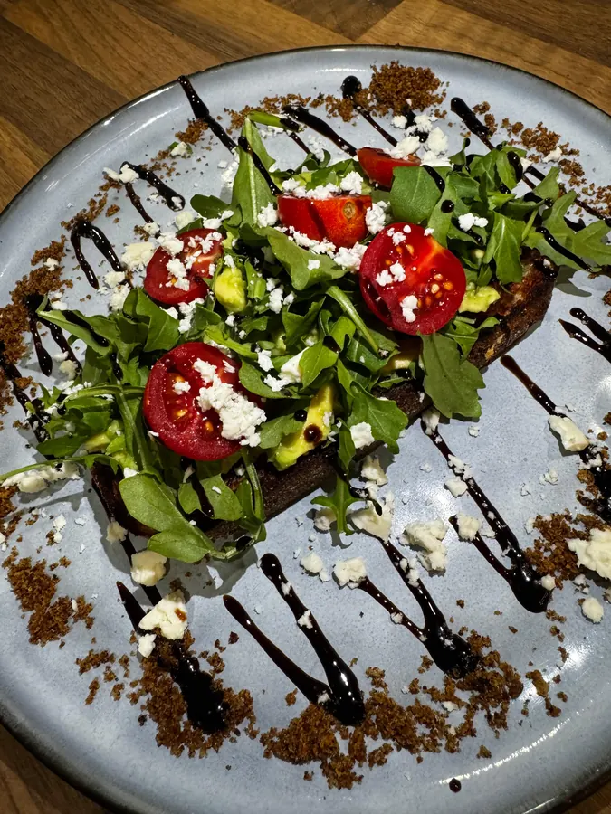 Avocado on toast with feta, cherry tomato and balsamic