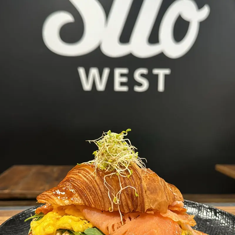 Croissant with smoked salmon under the Silo West sign