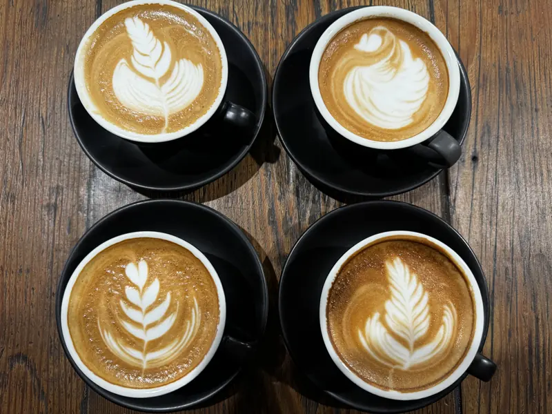 Four flat whites