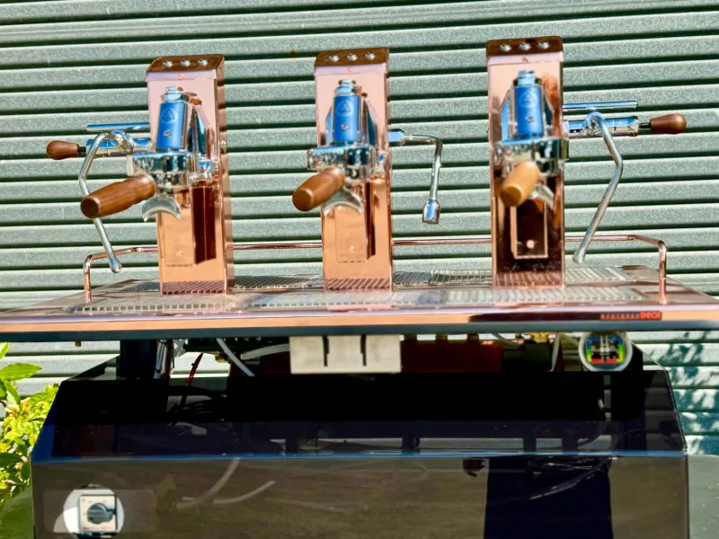 A copper three group espressoDECK, the same model as ours, photographed by espressoDECK