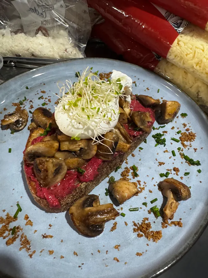 Mushroom toast with pink hummus and a poached egg
