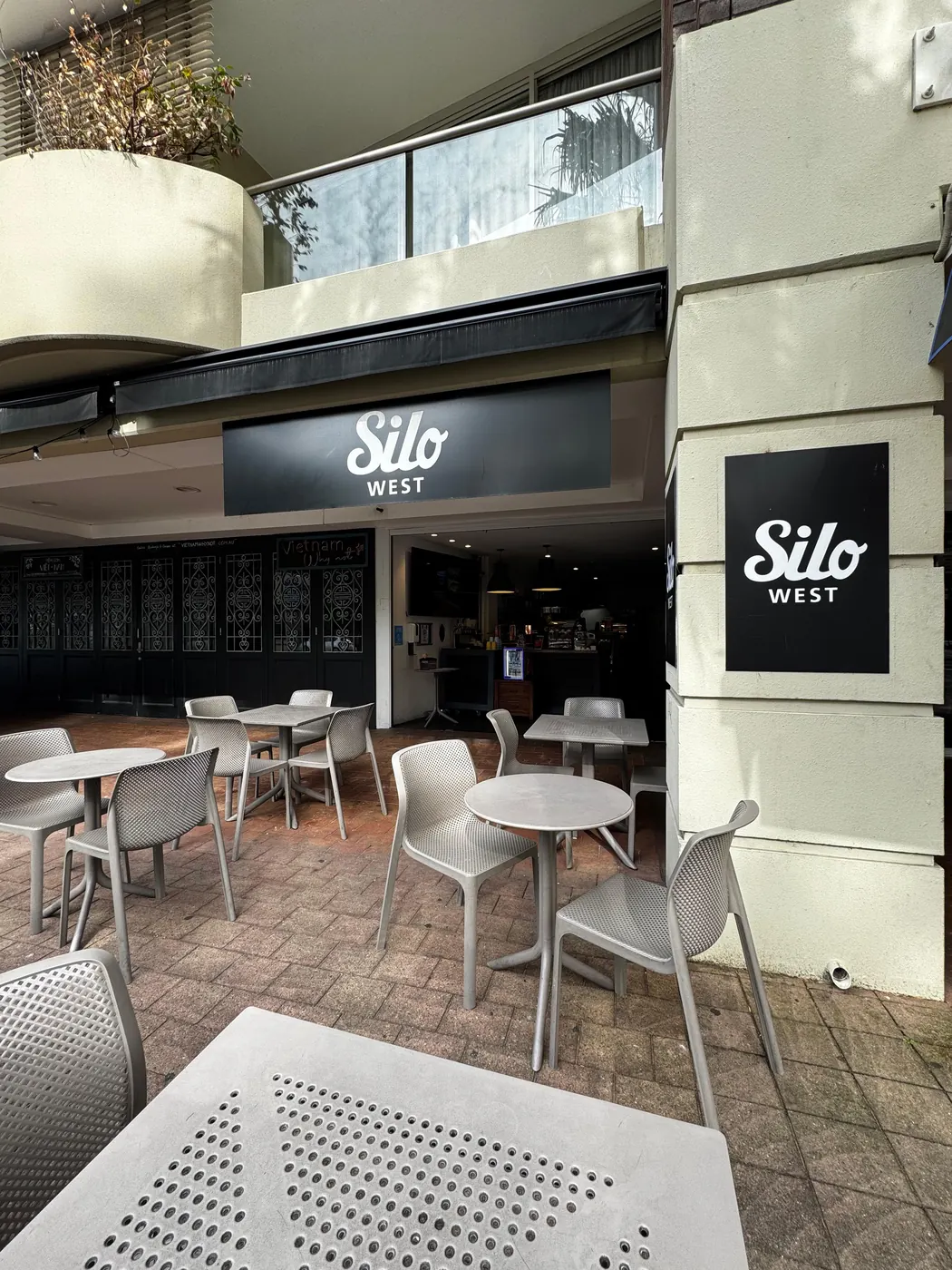 Tables and chairs on the footpath outside Silo West